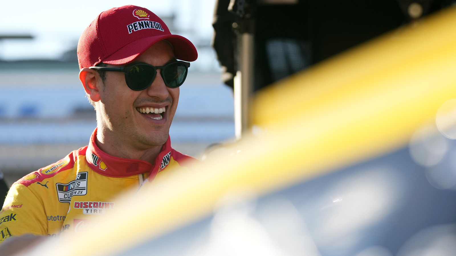 Joey Logano slides, hits the inside wall hard during practice at Homestead-Miami