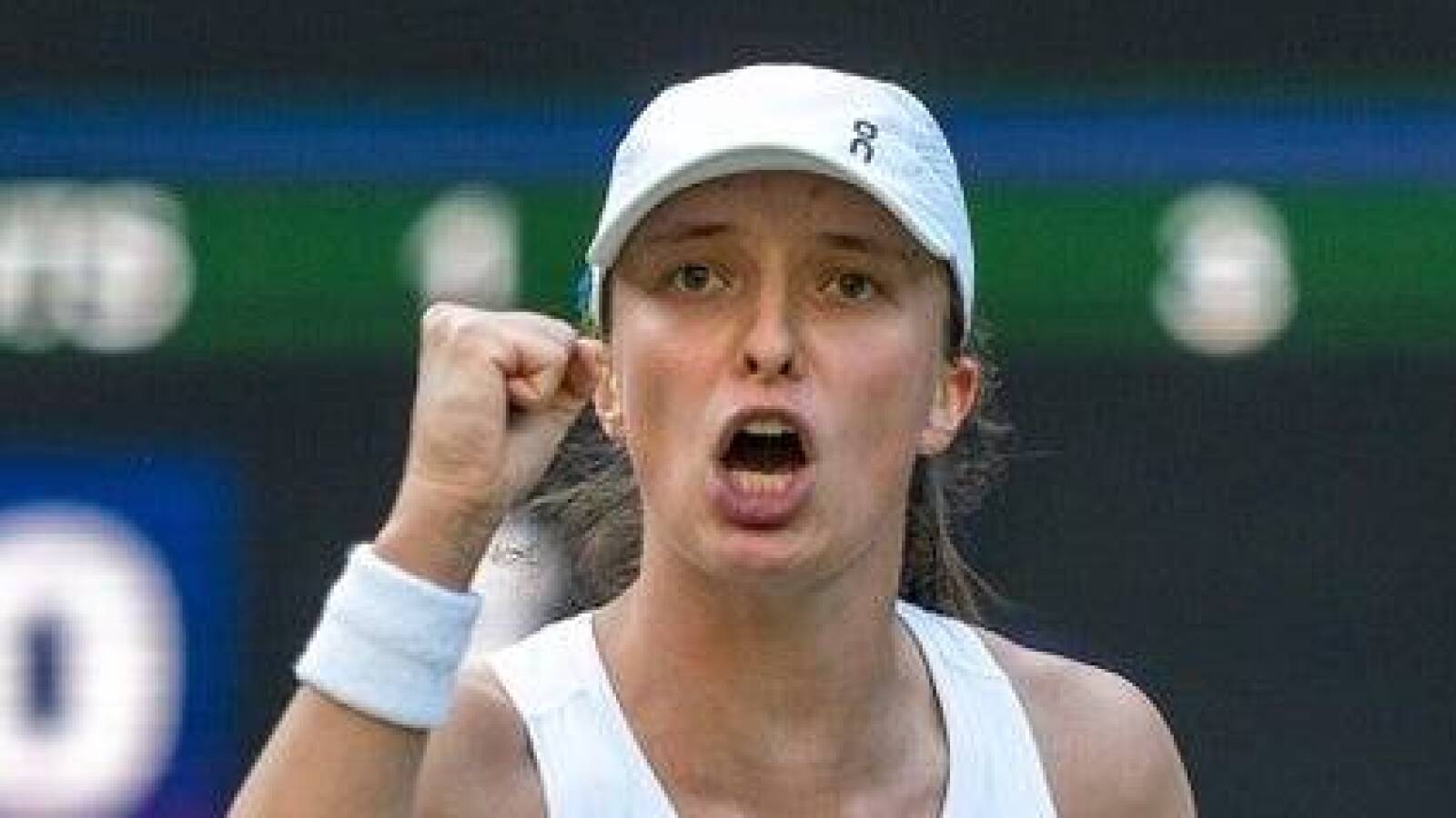 No. 1 Iga Swiatek survives to reach her first Wimbledon quarterfinal