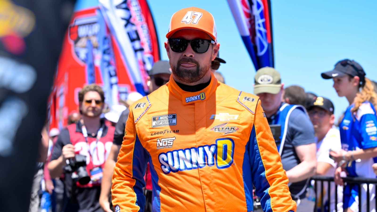 http://www.yardbarker.com/media/8/b/8b3340cb675a5c4cec3498e3470e377a35744538/thumb_16x9/ricky-stenhouse-wears-infamous-camo-shorts-from-kyle-busch-fight-at-2025-all-star-race.jpg