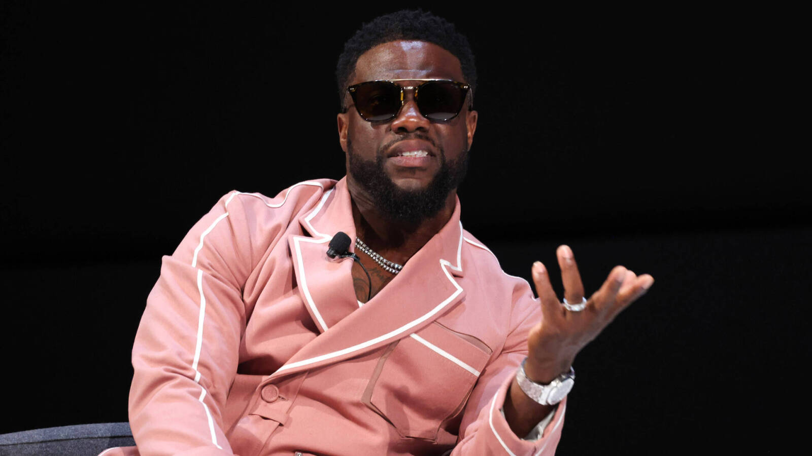 Kevin Hart pokes fun at himself from wheelchair after racing ex-NFL RB