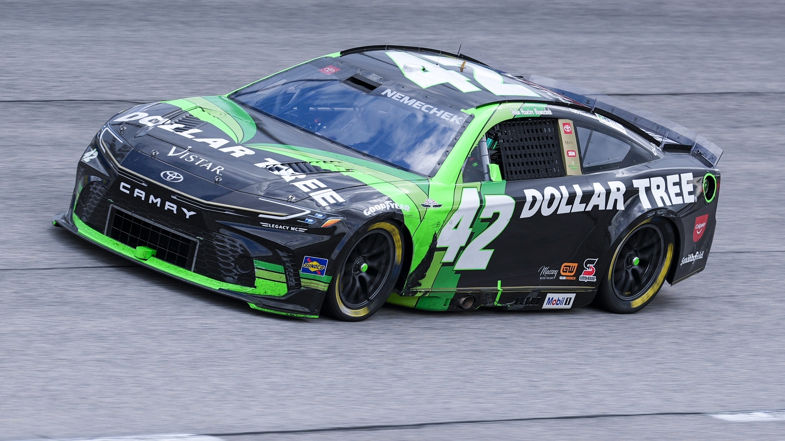 John Hunter Nemechek wheel comes off on pit road, nearly takes out Daniel Suárez crew member