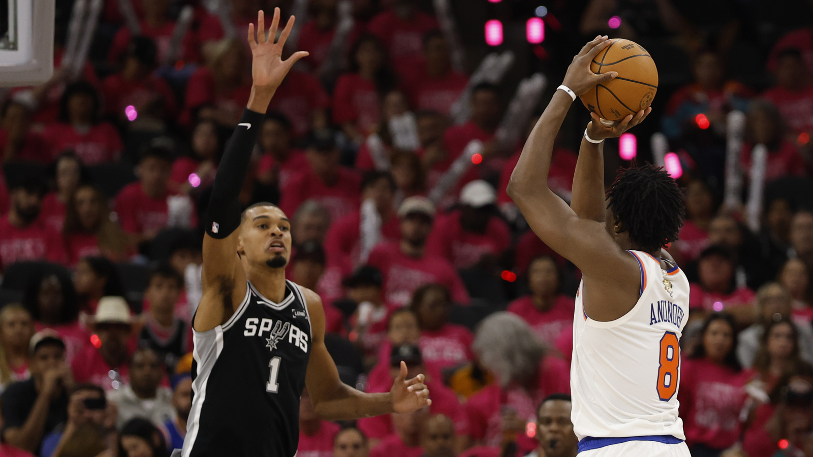 Spurs' Victor Wembanyama reacts to fan running on court in Game 1 of 2026 NBA Finals
