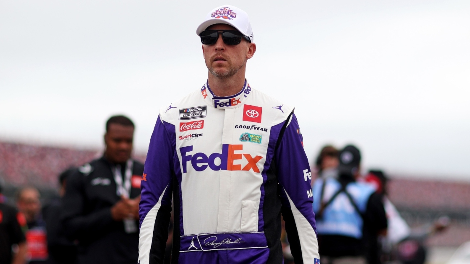 Denny Hamlin spins entering pit road, claims he hit a puddle