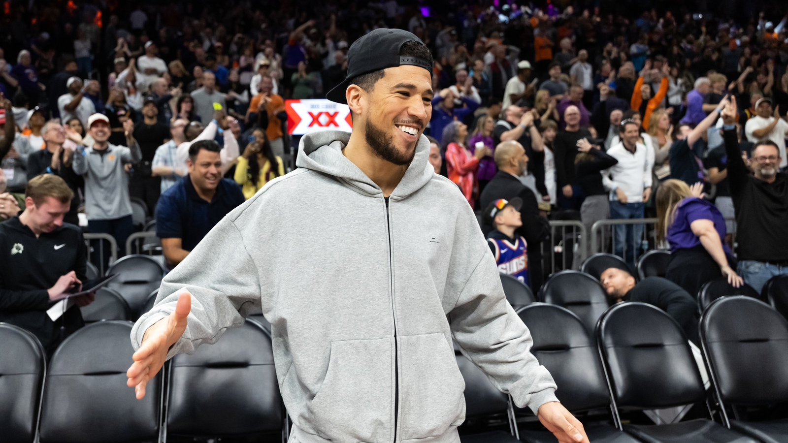 Rapper J. Cole shouts out Suns star Devin Booker at pop-up event in ...