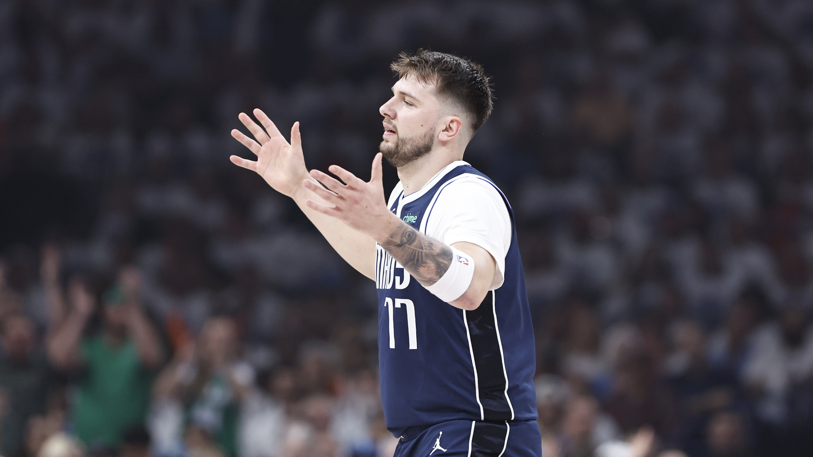 Watch: Luka Doncic stares as courtside OKC fan bizarrely throws ball away from him