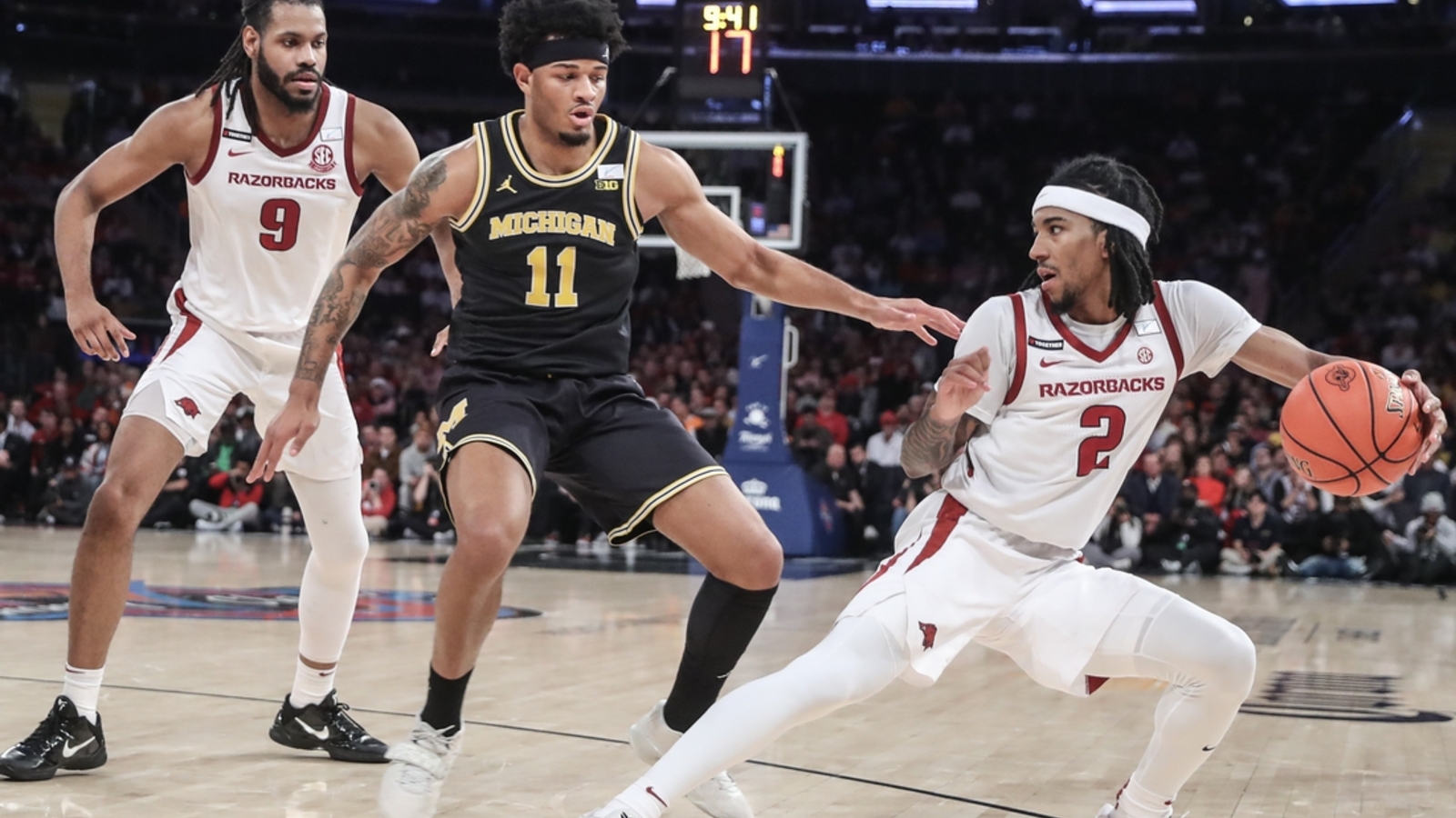 Top 25 roundup: Arkansas' rally ends No. 14 Michigan's win streak ...