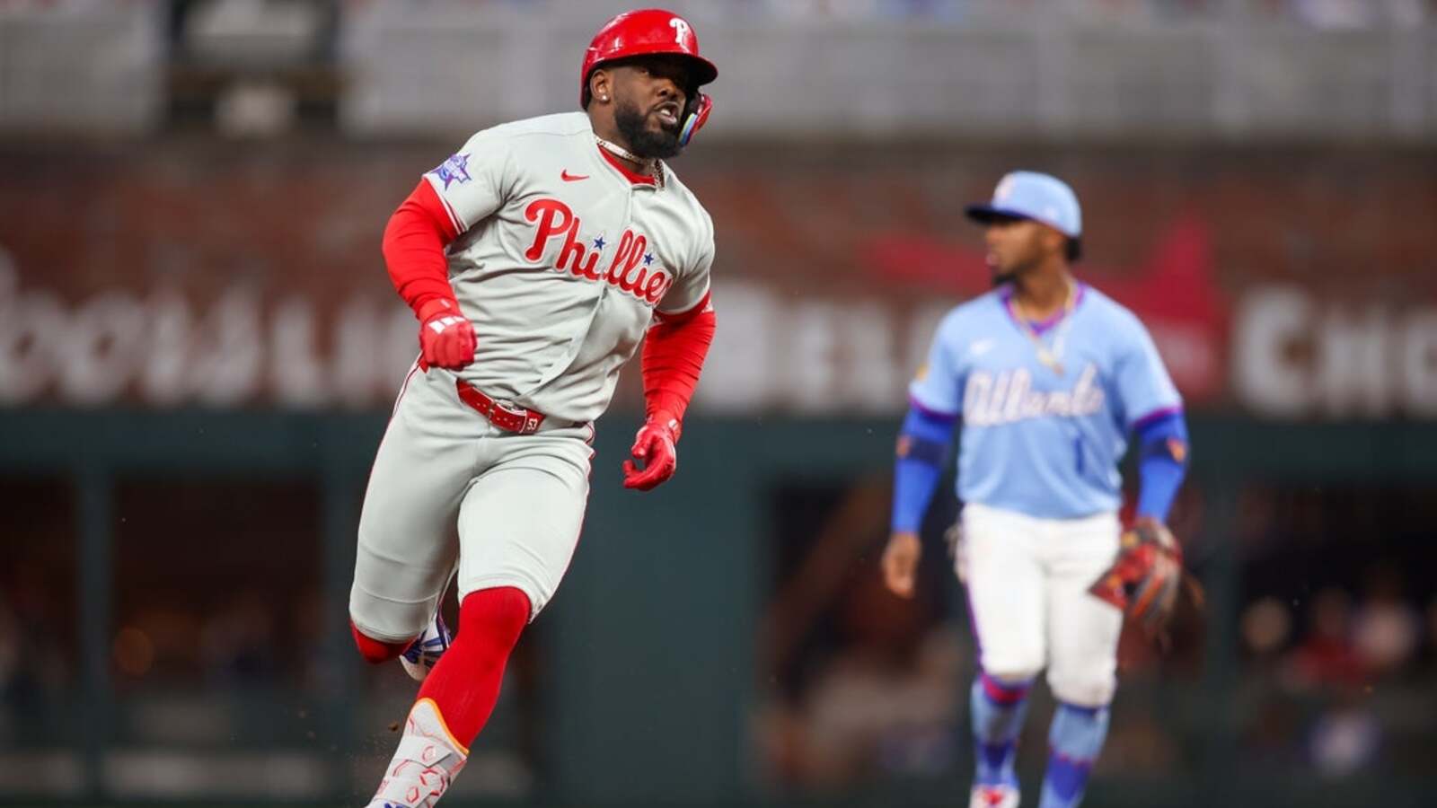 Phillies snap 10-game skid with extra-inning defeat of Braves