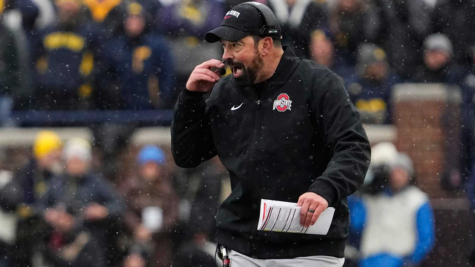 Michigan players guarded their logo after losing to Ohio State