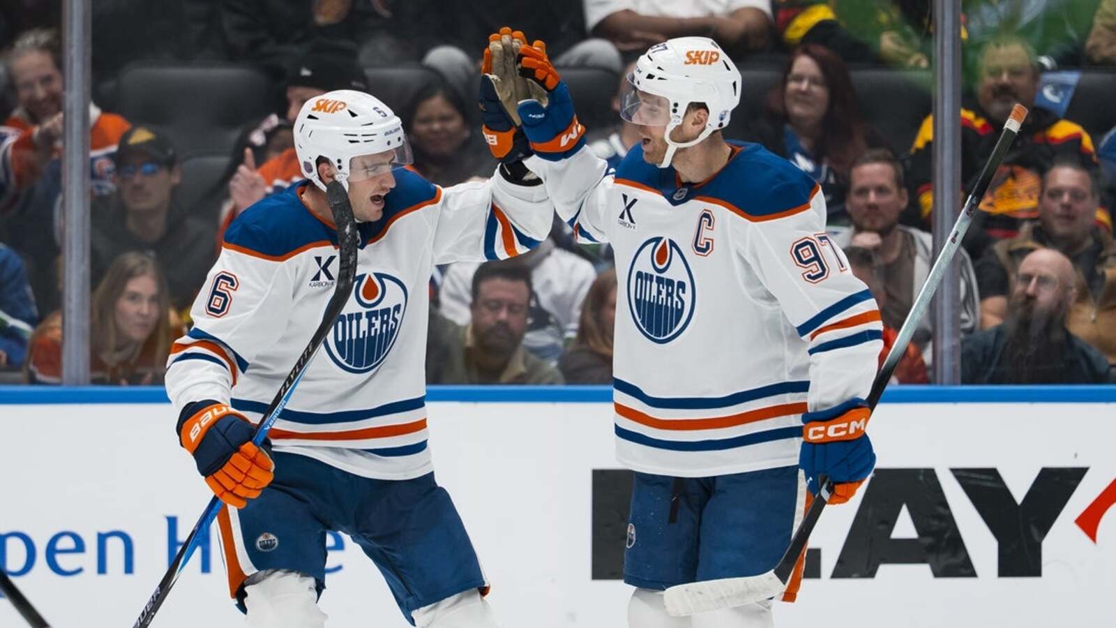 Evan Bouchard, Connor McDavid make waves as Oilers beat Canucks 9-7
