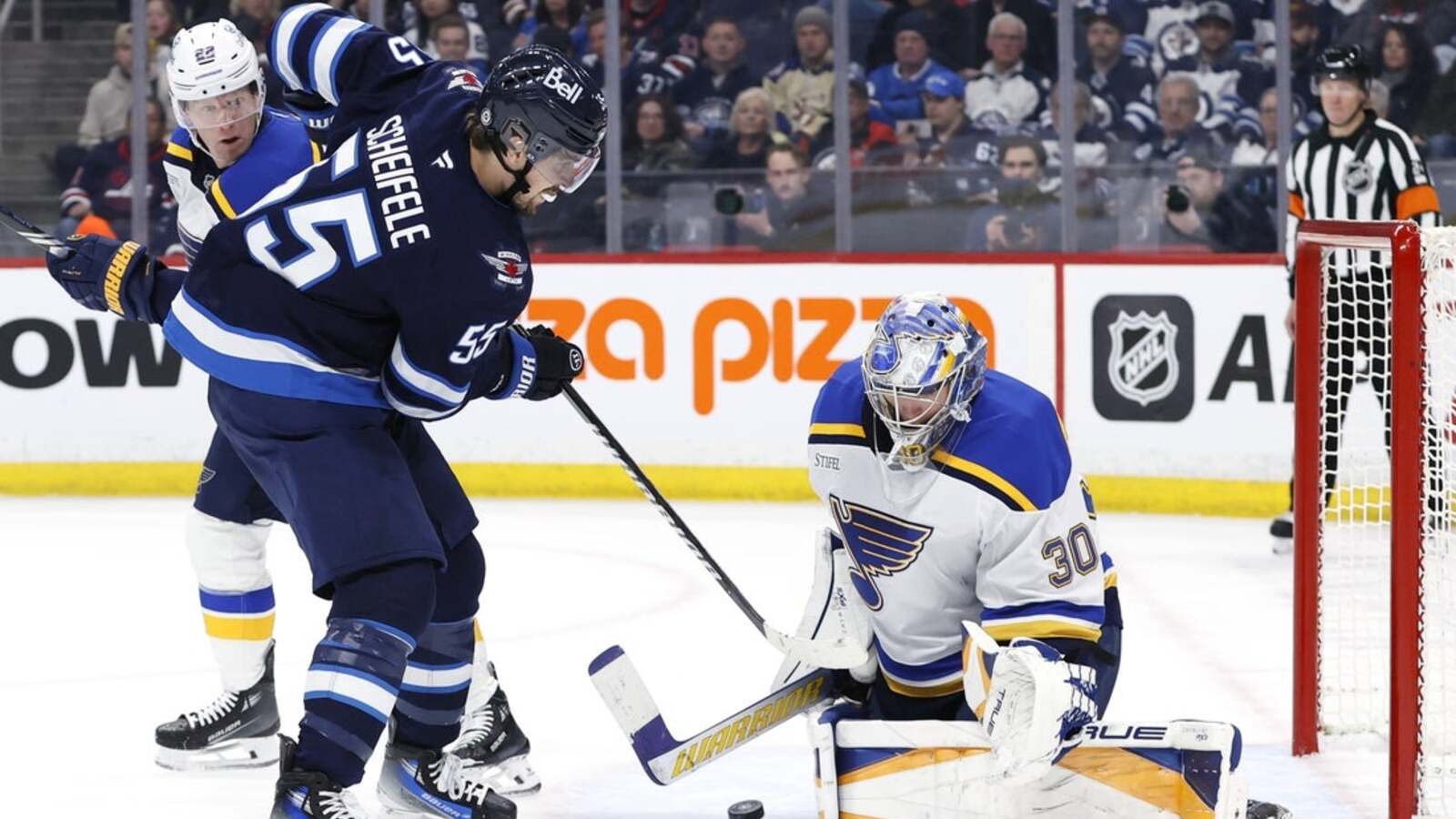 NHL-leading Jets halt Blues' 12-game win streak