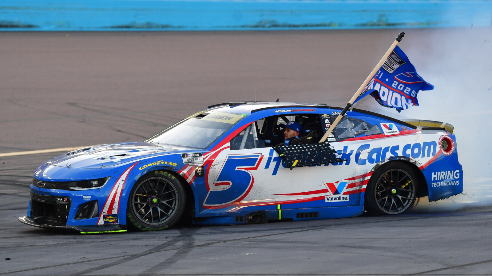 https://www.yardbarker.com/media/a/6/a6153a5cba1f4de9585bd1791b7149cfc0d7ab87/thumb_16x9/kyle-larson-5-celebrates-his-victory-2025-nascar.jpg?v=1
