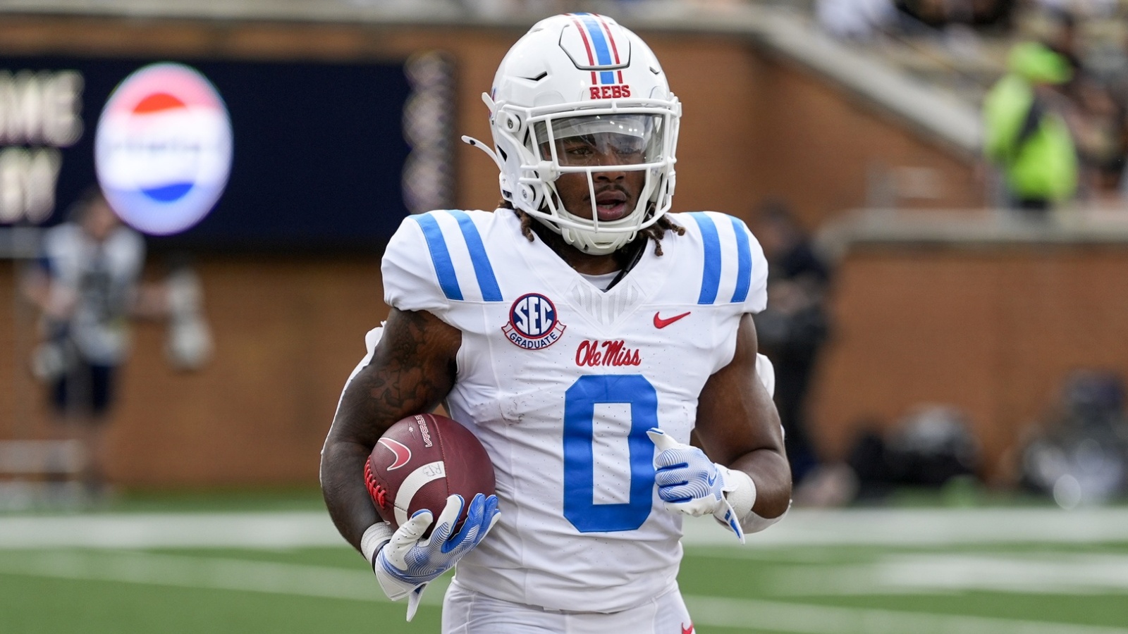 Watch: Ole Miss RB appears to fake injury, called out on broadcast