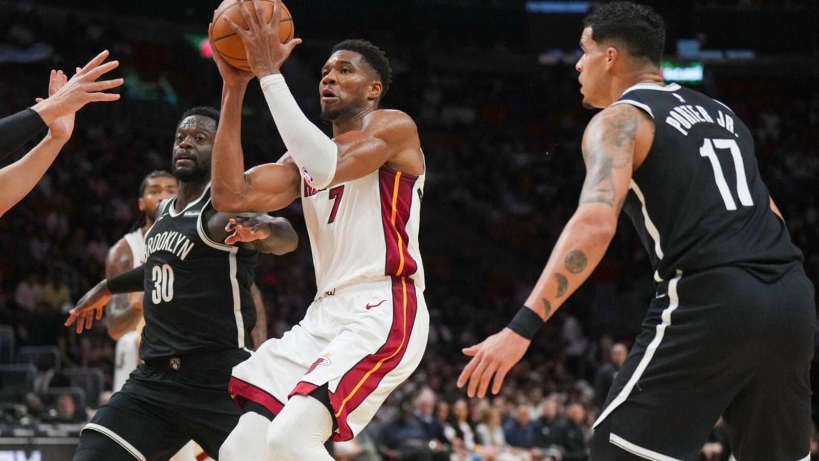After blockbuster trades, new-look Heat and Wolves clash in Miami