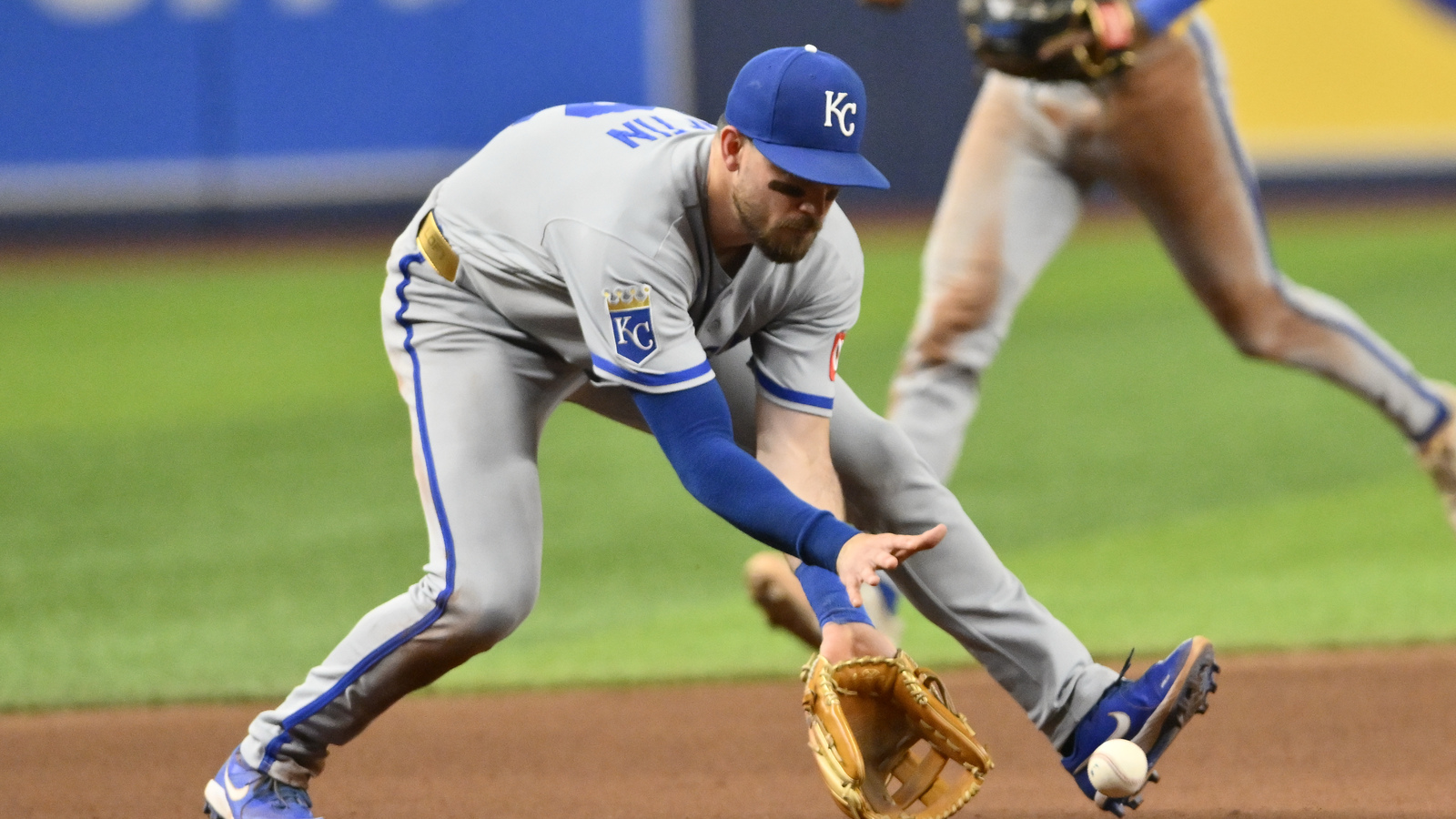 alt="Kansas City Royals third baseman Nick Loftin fields the ball"